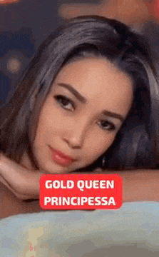 a close up of a woman 's face with a red sign that says gold queen principiessa .