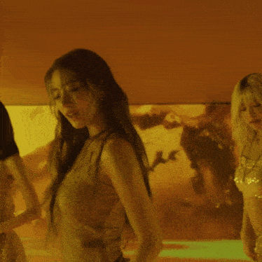 a woman in a striped tank top is dancing