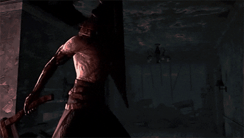 a statue of a man is holding a large axe in a dark room