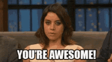 a woman is sitting on a couch with the words `` you 're awesome '' written on her face .