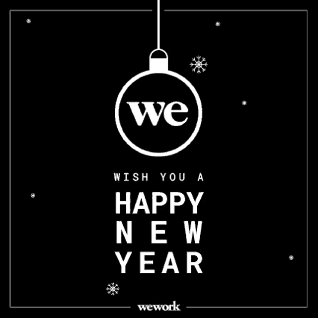 we work wish you a happy new year greeting card with a christmas ball hanging from a string .
