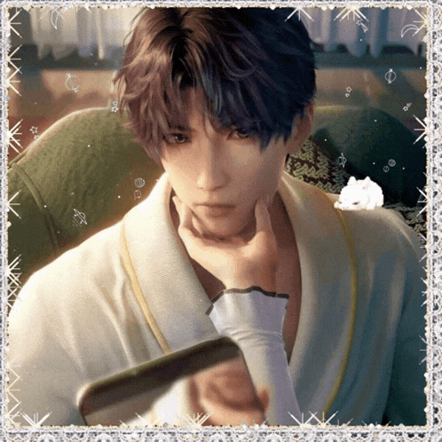 a man in a white robe holds his hand to his face