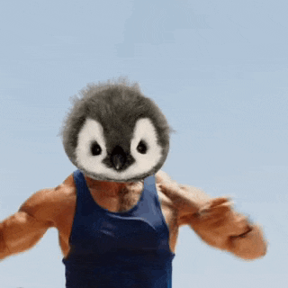 a man with a stuffed penguin head on his chest