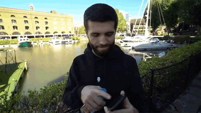 a man in a black hoodie with a skull on it