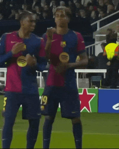 two soccer players on a field with the number 3 on their jerseys