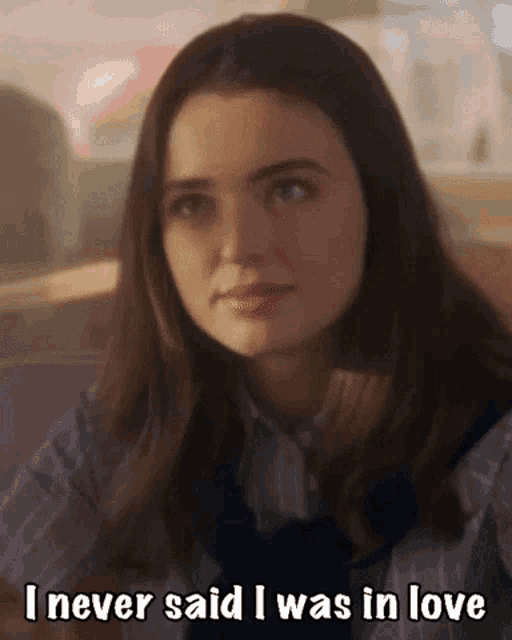 a woman is sitting in a diner and says `` i never said i was in love ''