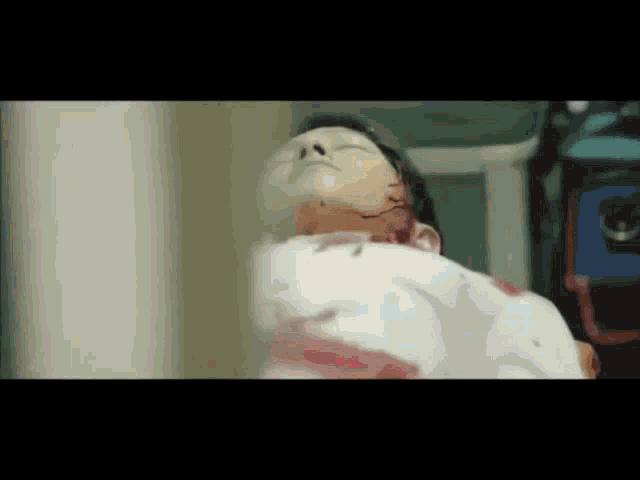 a close up of a person laying on a bed