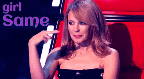 a woman in a black strapless dress is pointing her finger at the word girl same
