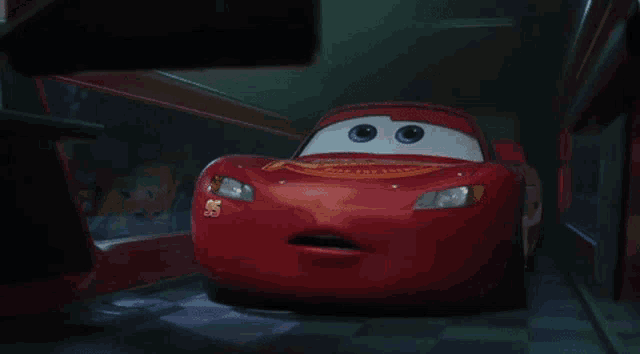 a red cartoon car with the number 55 on the side of it
