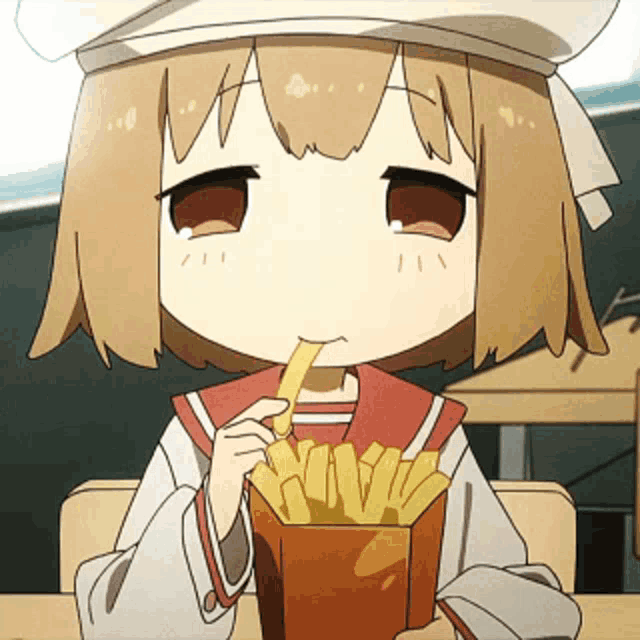 a girl is eating french fries in a box