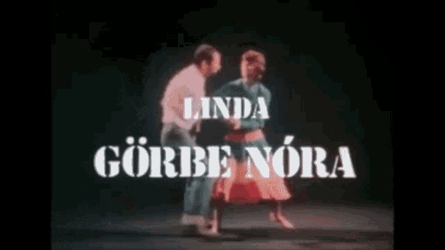 a man and a woman are dancing in front of the words linda gorbe nora