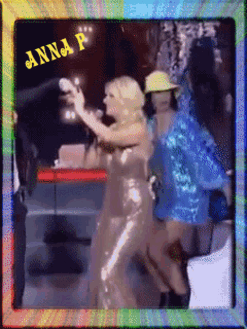 a picture of anna p dancing with a microphone