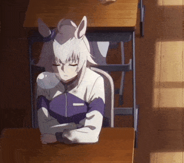 a girl with white hair and horns sits at a desk