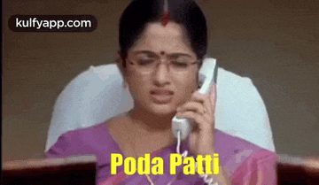 a woman wearing glasses is talking on a phone .