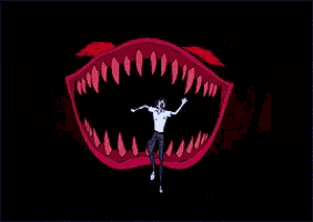 a cartoon of a man standing in a monster 's mouth