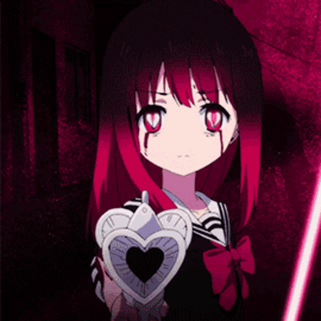 a girl with red hair is holding a heart shaped device