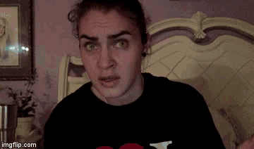 a woman is making a funny face in front of a bed with imgflip.com at the bottom of the screen