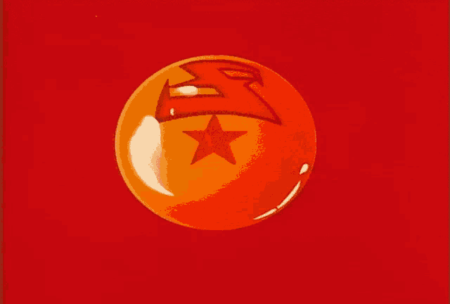 an orange ball with a red star in the center