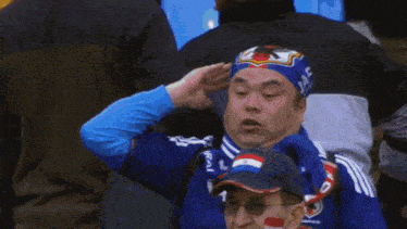 a man wearing a bandana with the word japan on it