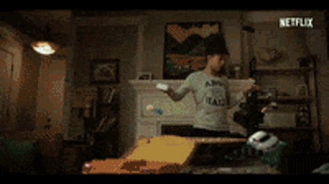 a person is jumping into a body of water with a netflix logo in the background .