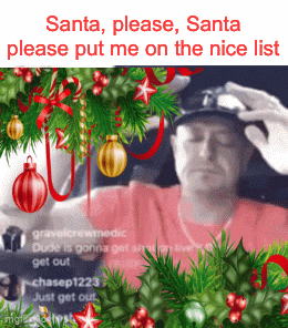 a man in a baseball cap is surrounded by christmas decorations