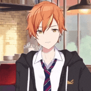 a boy with orange hair is wearing a tie