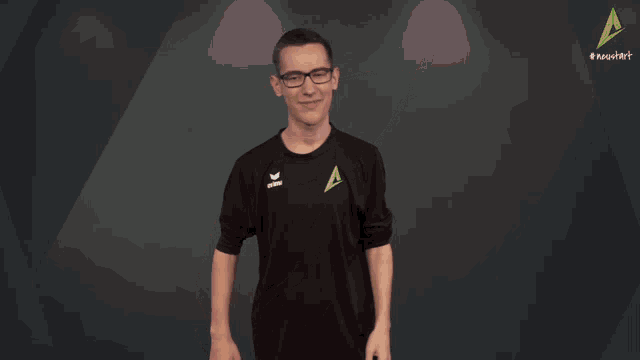 a man wearing glasses and a black shirt that says erima on it