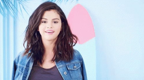 Selena Gomez Shrugs GIF - Selena Gomez Shrugs Shrug GIFs