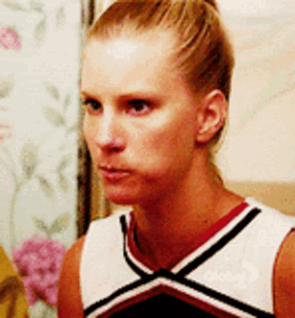 a woman wearing a cheerleader uniform with the word global on the front