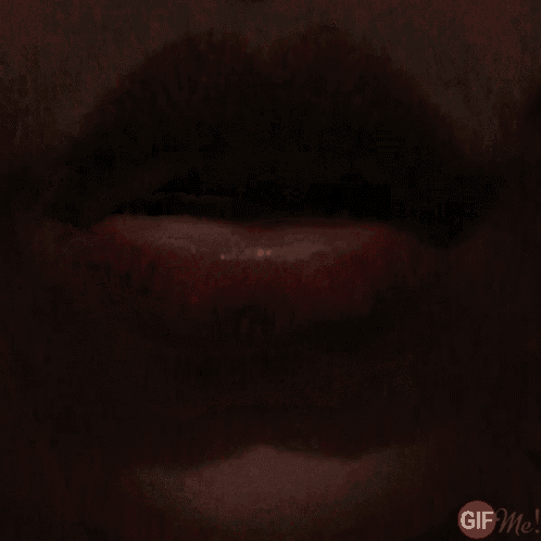 a close up of a woman 's mouth with a gif9.com logo in the lower right corner