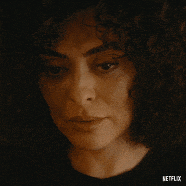 a close up of a woman 's face with the word netflix on the bottom