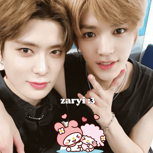 two young men posing for a picture with the name zaryi on the bottom right
