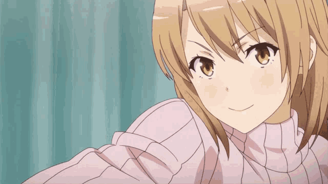 a girl in a pink sweater is looking at the camera