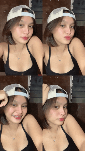 a woman wearing a hat and a black tank top