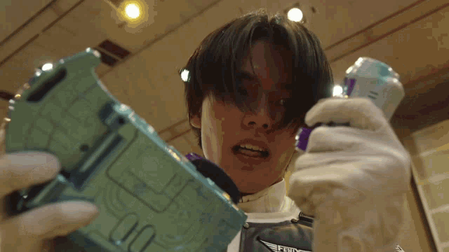 a man in a white glove is holding a device that says 00