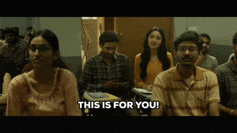 a group of people sitting in a classroom with the words " this is for you " on the bottom