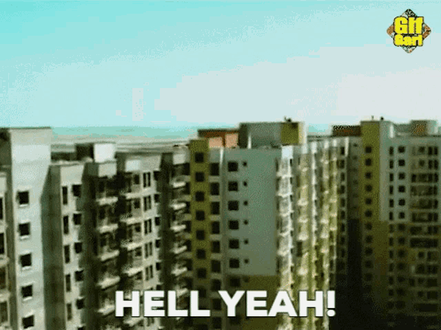 an aerial view of a city with a few buildings and the words `` hell yeah '' .