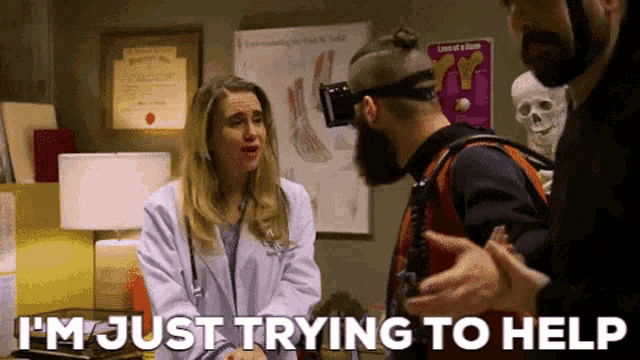 a man wearing a virtual reality headset is talking to a doctor who is saying i 'm just trying to help