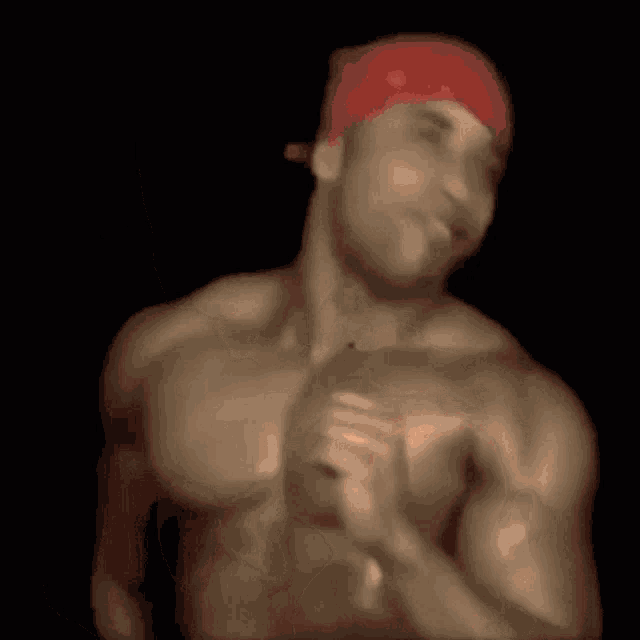 a close up of a person 's back with a red hat on their head