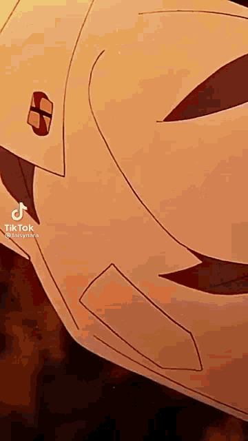 a close up of a person wearing a mask with a smiley face on it .