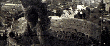 an aerial view of a city with buildings and a monster in the background