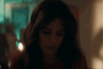 a close up of a woman 's face with her eyes closed .