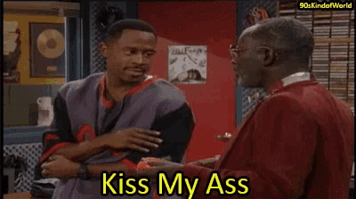 two men standing next to each other with the words kiss my ass on the bottom right