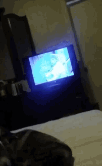 a tv is sitting on a table in a room