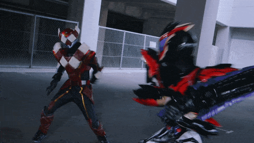 a man in a red and black costume is fighting another man in a purple and black costume
