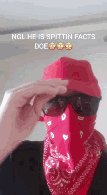 a man wearing sunglasses and a red bandana with the words ngl he is spittin facts doe on the bottom