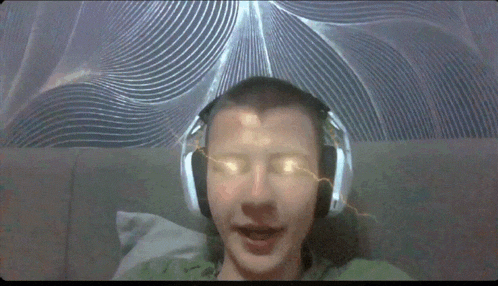 a man wearing headphones has a glowing eye