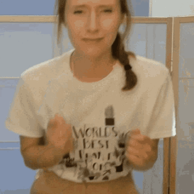 a woman wearing a t-shirt that says worlds best