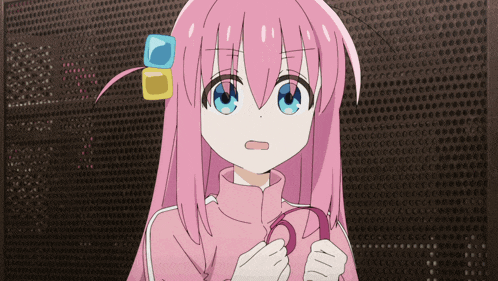 a girl with pink hair and blue eyes is holding something