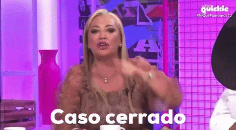 a woman is sitting at a table with the words caso cerrado in front of her